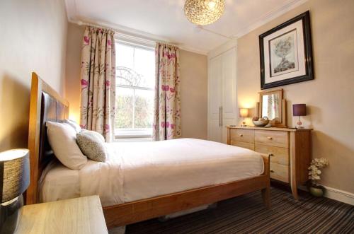 Postel nebo postele na pokoji v ubytování Chester Apartments