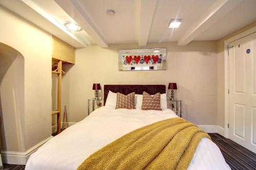 a bedroom with a large bed in a room at Chester Apartments in Chester