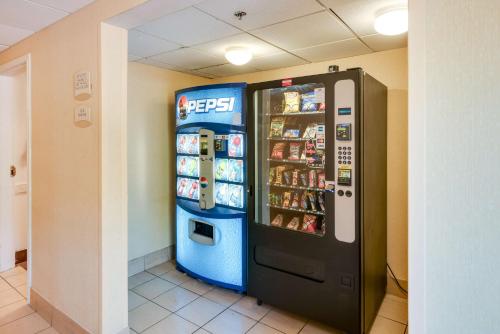 a vending machine in a room next to a wall at Motel 6-Milford, CT in Milford