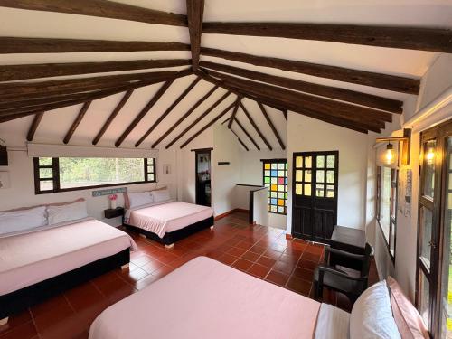 Postel nebo postele na pokoji v ubytování CASA CAMPESTRE VILLA SANTANA