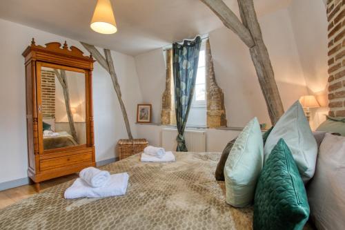 Ένα ή περισσότερα κρεβάτια σε δωμάτιο στο Sarlat en Couleurs