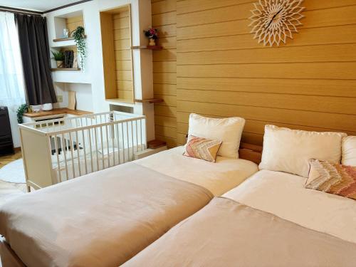 two beds sitting next to each other in a room at 芋ノ宿ー大正 in Osaka