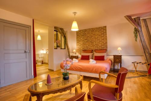 Ένα ή περισσότερα κρεβάτια σε δωμάτιο στο Sarlat en Couleurs