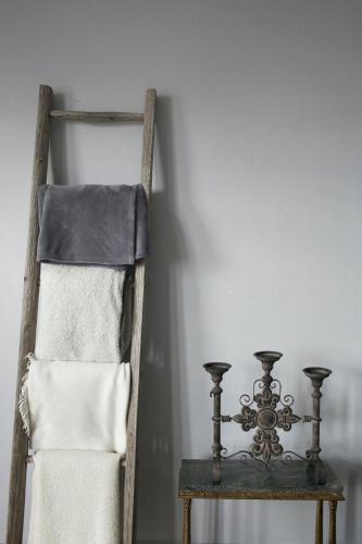 a wooden ladder next to a table with a towel at Von Otterska Villan i Gränna in Gränna