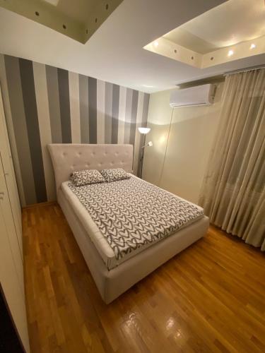 Postel nebo postele na pokoji v ubytování apartman the one - free parking