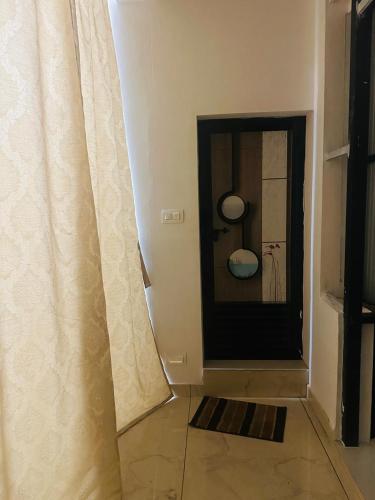 a room with a door with a curtain next to a room at AZURE stay happy in Pudunagaram
