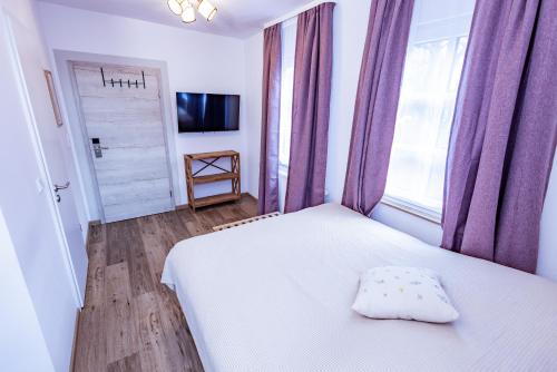 Postel nebo postele na pokoji v ubytování Gasthaus Alte Post