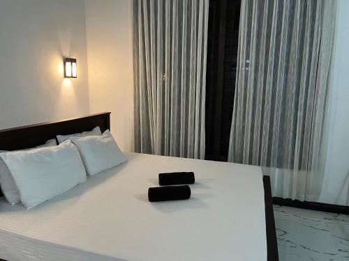 Ένα ή περισσότερα κρεβάτια σε δωμάτιο στο Green House Resort