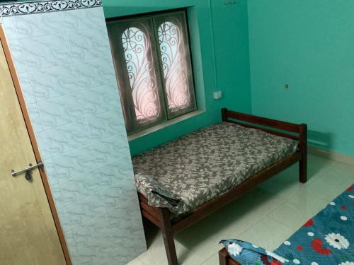 Ένα ή περισσότερα κρεβάτια σε δωμάτιο στο nandanam villlas