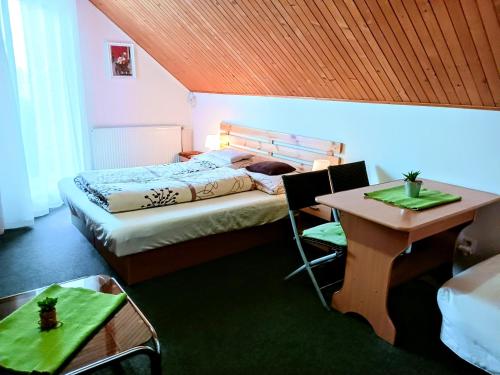 Postel nebo postele na pokoji v ubytování Privat Mária