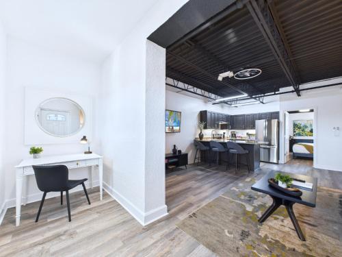 an open living room with a table and chairs at Bright Modern Loft by Port & Beaches -Unit 206 in Cape Canaveral