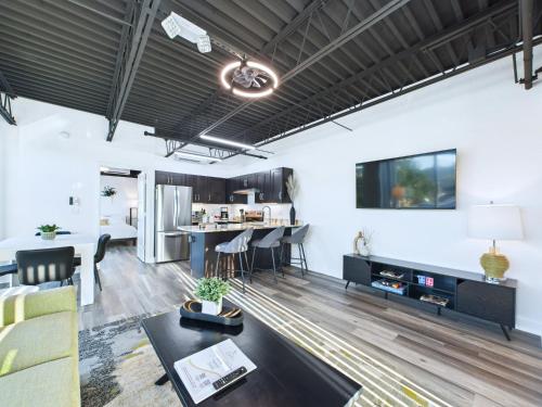 a living room with a couch and a table at Rocket Launch View Loft Near Beach & Port-Unit 209 in Cape Canaveral