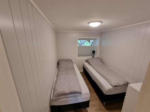 En eller flere senge i et værelse på Sentral leilighet