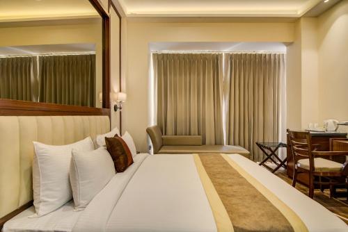Ένα ή περισσότερα κρεβάτια σε δωμάτιο στο Hotel The Gross Infinity Near Delhi Airport