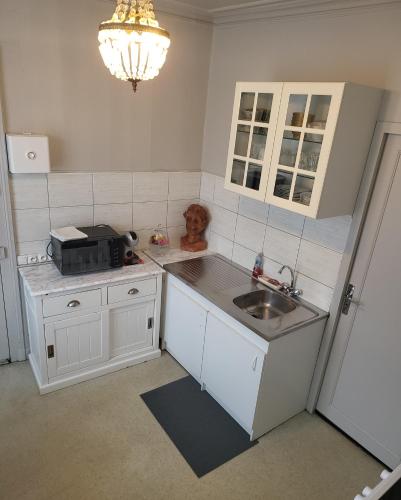 Kuchyň nebo kuchyňský kout v ubytování Le Figuier centre d Etretat et son parking privé à 5min