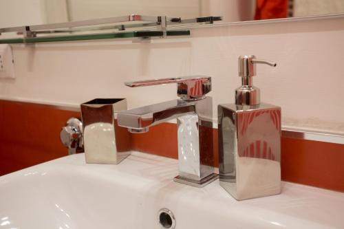 a bathroom sink with a chrome faucet at Casa Vacanze La Mattonara in Viterbo