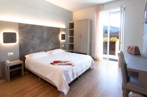 Postel nebo postele na pokoji v ubytování Hotel Meeting