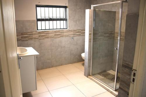 Ένα μπάνιο στο VinVid Harties Guest House