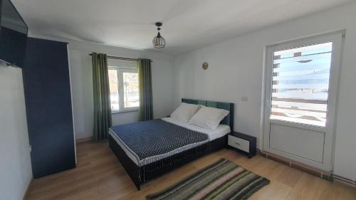 Postel nebo postele na pokoji v ubytování Casa Viorica -Botoș