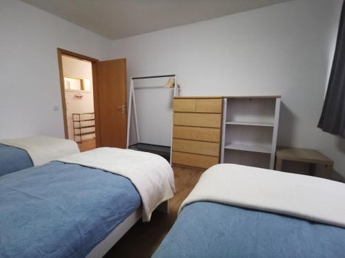 Postel nebo postele na pokoji v ubytování Home 18 - Monteurwohnung für 8 Personen