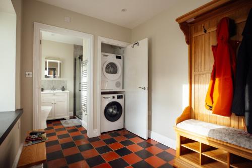 a laundry room with a washer and dryer at Homely Cottage - Beaches, Costal walks, Castles in Newchapel