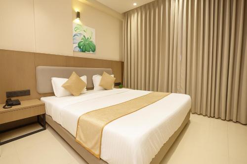 Postel nebo postele na pokoji v ubytování M Square Express