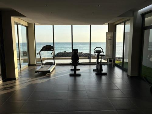 a gym with a view of the ocean at Studio B Luxury - Waterfront in Dakar