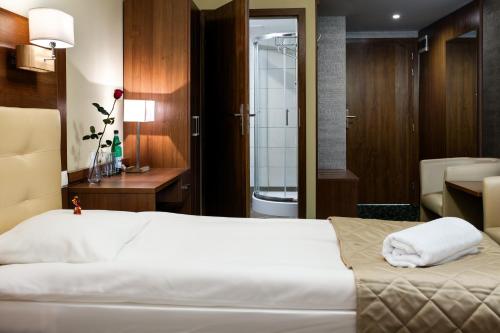 Ein Bett oder Betten in einem Zimmer der Unterkunft Hotel Royal Botanic
