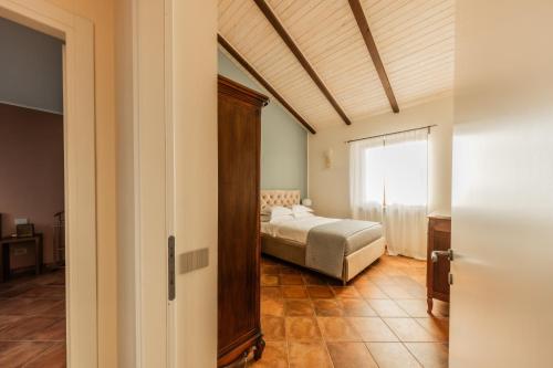 Postel nebo postele na pokoji v ubytování Casa Nizza D'Oro