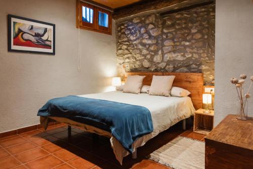 Postel nebo postele na pokoji v ubytování El racó a Anserall. A 8km Andorra.