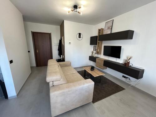 Posezení v ubytování Modern apartment, terrace, AC and WiFi