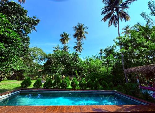 Bazén v ubytování Island tropical retreat nebo v jeho okolí