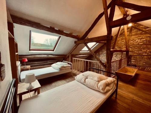Postel nebo postele na pokoji v ubytování Nature, chaleur, calme et confort au coeur des Ardennes belges