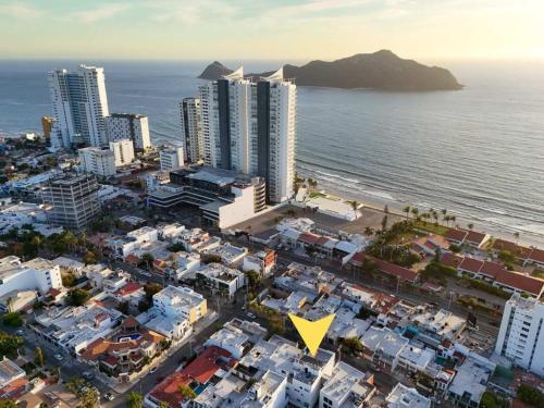 an aerial view of a city and the ocean at Cozy apartment just two blocks from the beach in Isla Venados