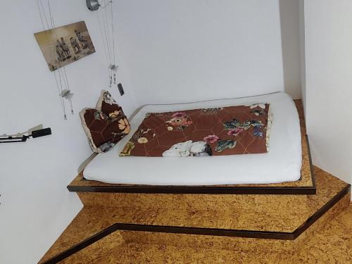 a bed on a wooden platform in a room at RuheUndSonne Apartment in Lichtenau