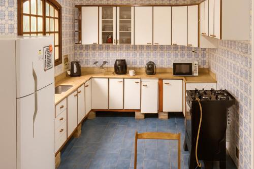 Kuchyň nebo kuchyňský kout v ubytování Hostel Casa de Pedra