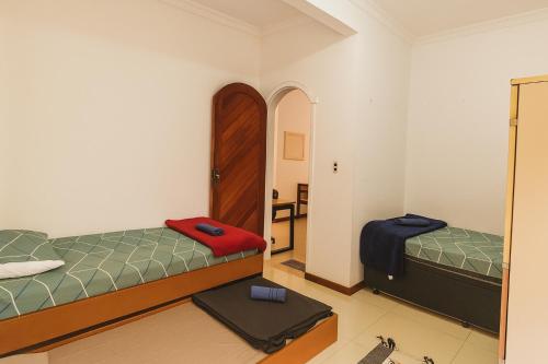 Postel nebo postele na pokoji v ubytování Hostel Casa de Pedra