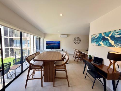 a living room with a table and chairs at Modern Luxury Residency at Altea-Sunset Pool View in Puerto Vallarta
