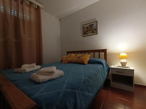 Postel nebo postele na pokoji v ubytování Microcentro Sanjuanino