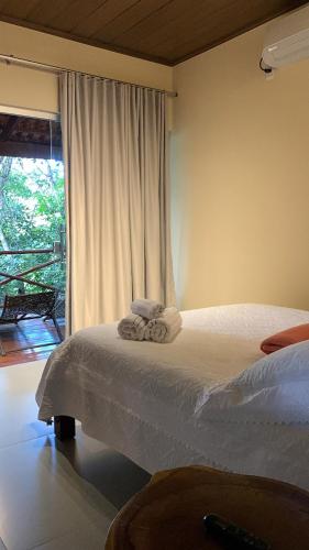 Postel nebo postele na pokoji v ubytování Encanto das Flores