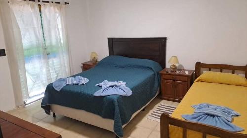 En eller flere senge i et værelse på Bosquesito