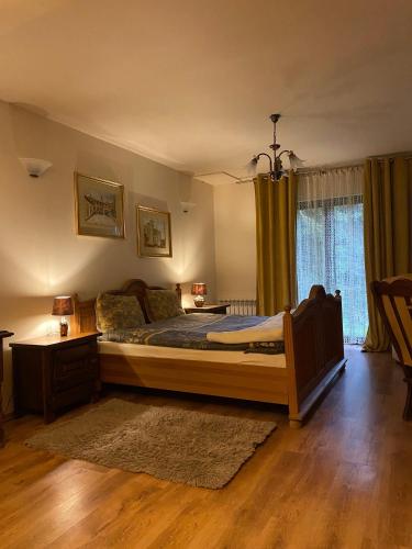 Postel nebo postele na pokoji v ubytování Domek Wiedźmy