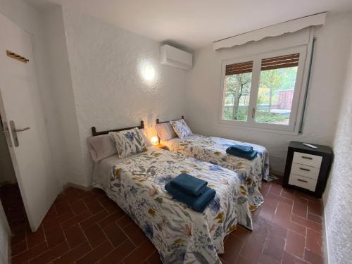 Ένα ή περισσότερα κρεβάτια σε δωμάτιο στο Mas Oliver de Mas Pujol