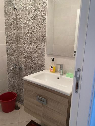 a bathroom with a sink and a shower at HALA Chaouni in Tétouan