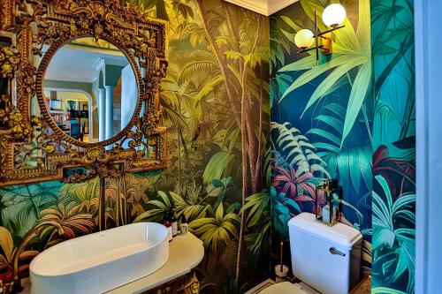 a bathroom with a sink and a mirror at Villa Bel Fiori - 4 Bedroom Villa in Ballito