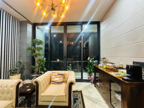 a living room with a couch and a table at Shanti vilas in Jaipur