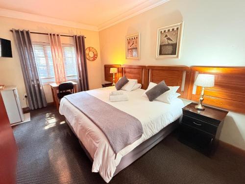 Ένα ή περισσότερα κρεβάτια σε δωμάτιο στο Kniff un Gaffel Guest House