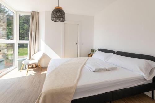 En eller flere senge i et værelse på Las casitas de mache - JL