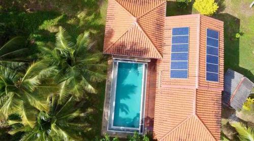 an aerial view of a house with a swimming pool at Forest Avenue - Kurunegala in Torayaya