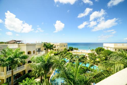 a view of the beach from the balcony of a resort at The Hamilton Beach Villas & Spa in Nevis